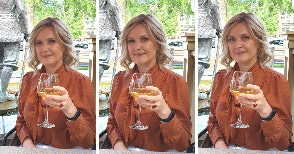 Gifts for Mom Who Don’t Want Anything (20 Best Thoughtful Gift Ideas) 3 Photo of Irina founder of Modern Fifty TV with a glass of white wine celebrating Mother's day