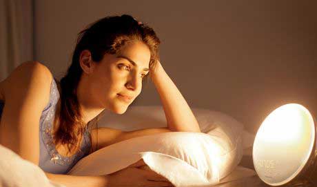 Gifts for Mom Who Don’t Want Anything (20 Best Thoughtful Gift Ideas) 16 women on the bed looking at the night light