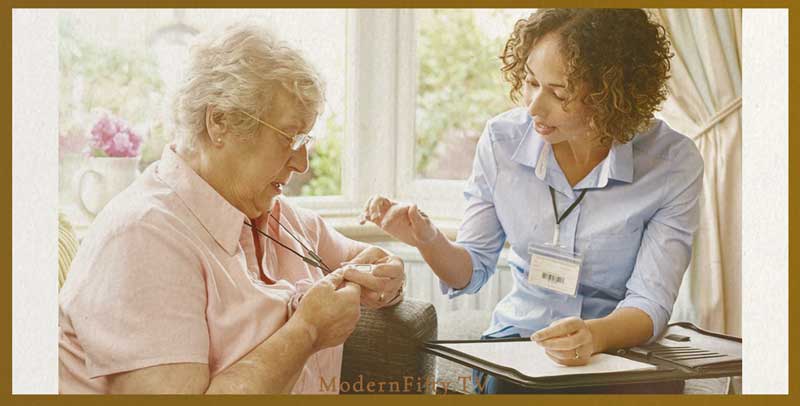 senior women learning how to use medical alert necklace