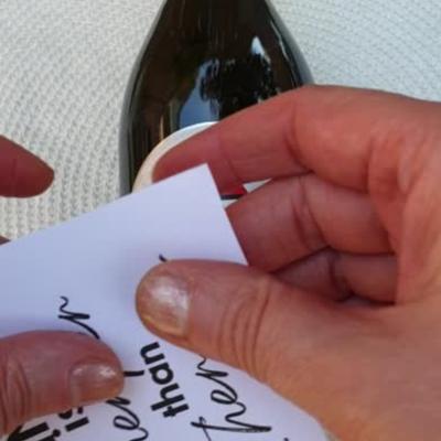 Retirement gift idea – how to make a personalized wine bottle label 9 STEP 7 applying the customized printed label to the bottle
