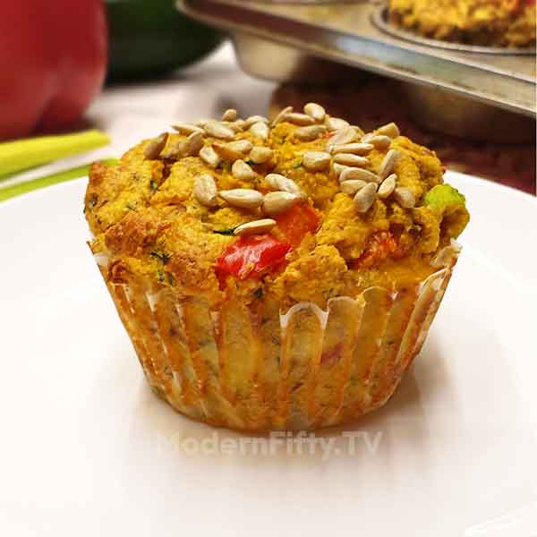 Low Carb Savory Zucchini Muffins - KETO 2 image of a low carb savory zucchini muffin with bell pepper and green onions.