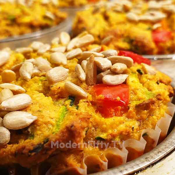 Low Carb Savory Zucchini Muffins - KETO 7 savory zucchini muffin with sunflower seeds sprinkled on top