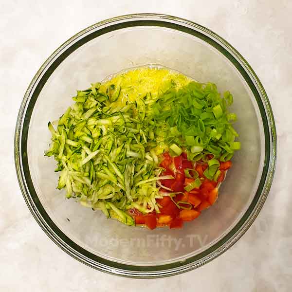 Low Carb Savory Zucchini Muffins - KETO 3 In a large-sized mixing bowl, grated zucchini, bell pepper, onions if using and melted coconut oil.