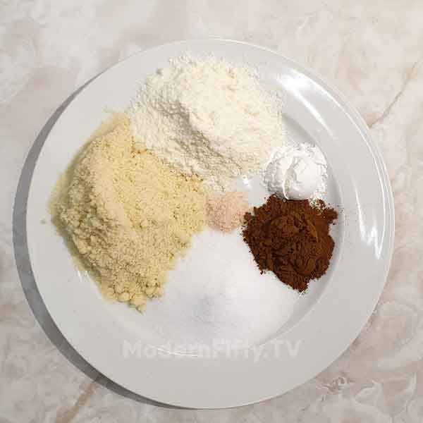 Low Carb Pumpkin Spice Cookies - KETO 7 all dry ingredients for the recipe almond flour, coconut flour, pumpkin spice, salt and switner.